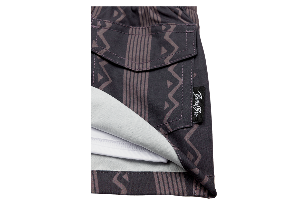 Stylish Mesa swim shorts featuring a geometric pattern and a comfortable inner lining, perfect for active kids.