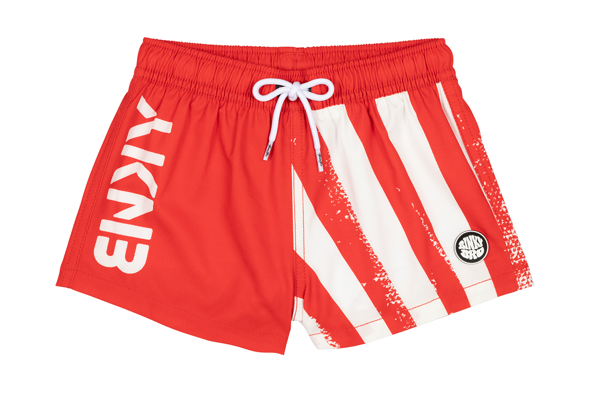 Red swim shorts featuring white stripes and the BinkyBro logo, designed for active kids with a stylish surf-snow-skate vibe.
