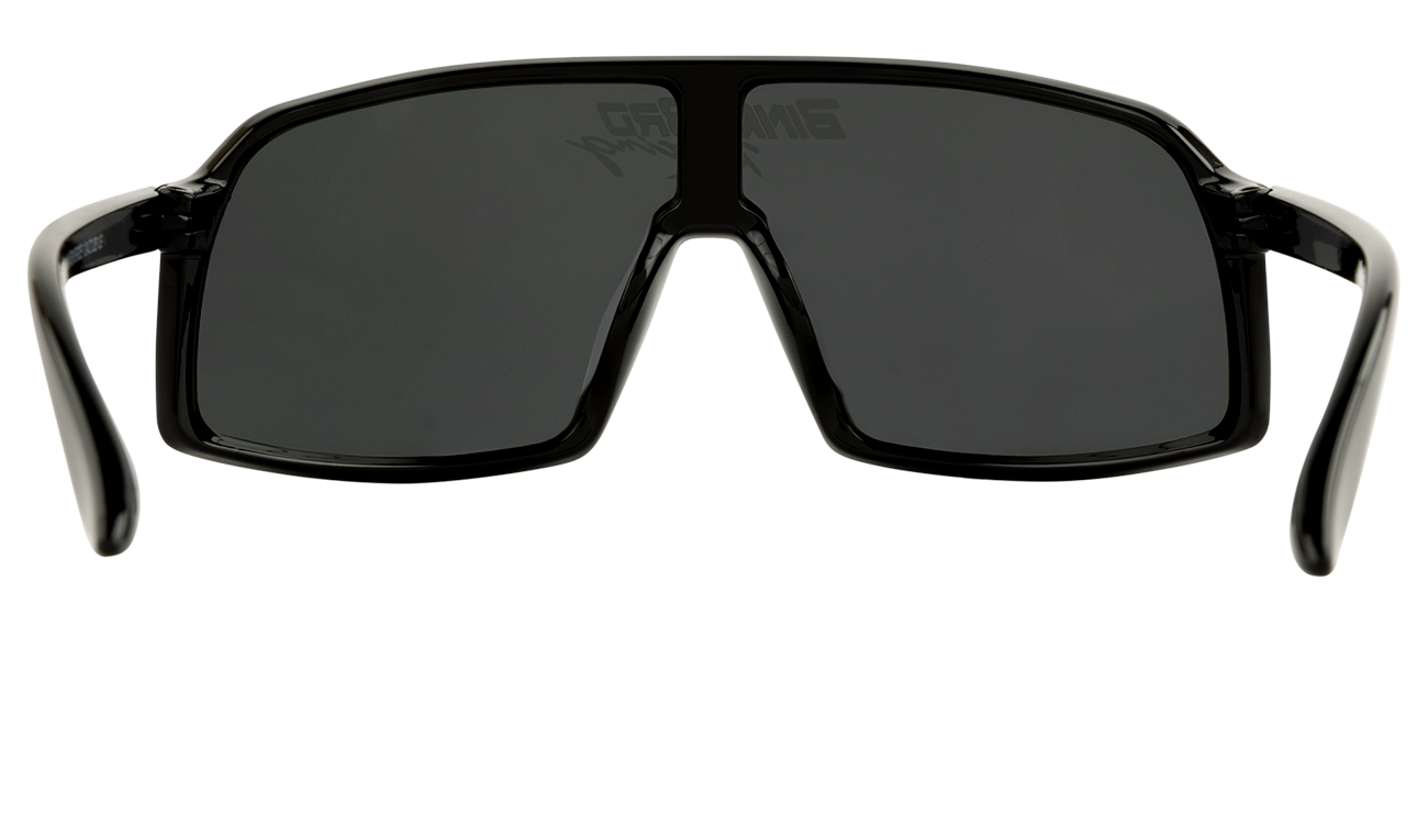 Stylish black sunglasses with a bold rectangular frame and dark lenses, perfect for young racing enthusiasts.