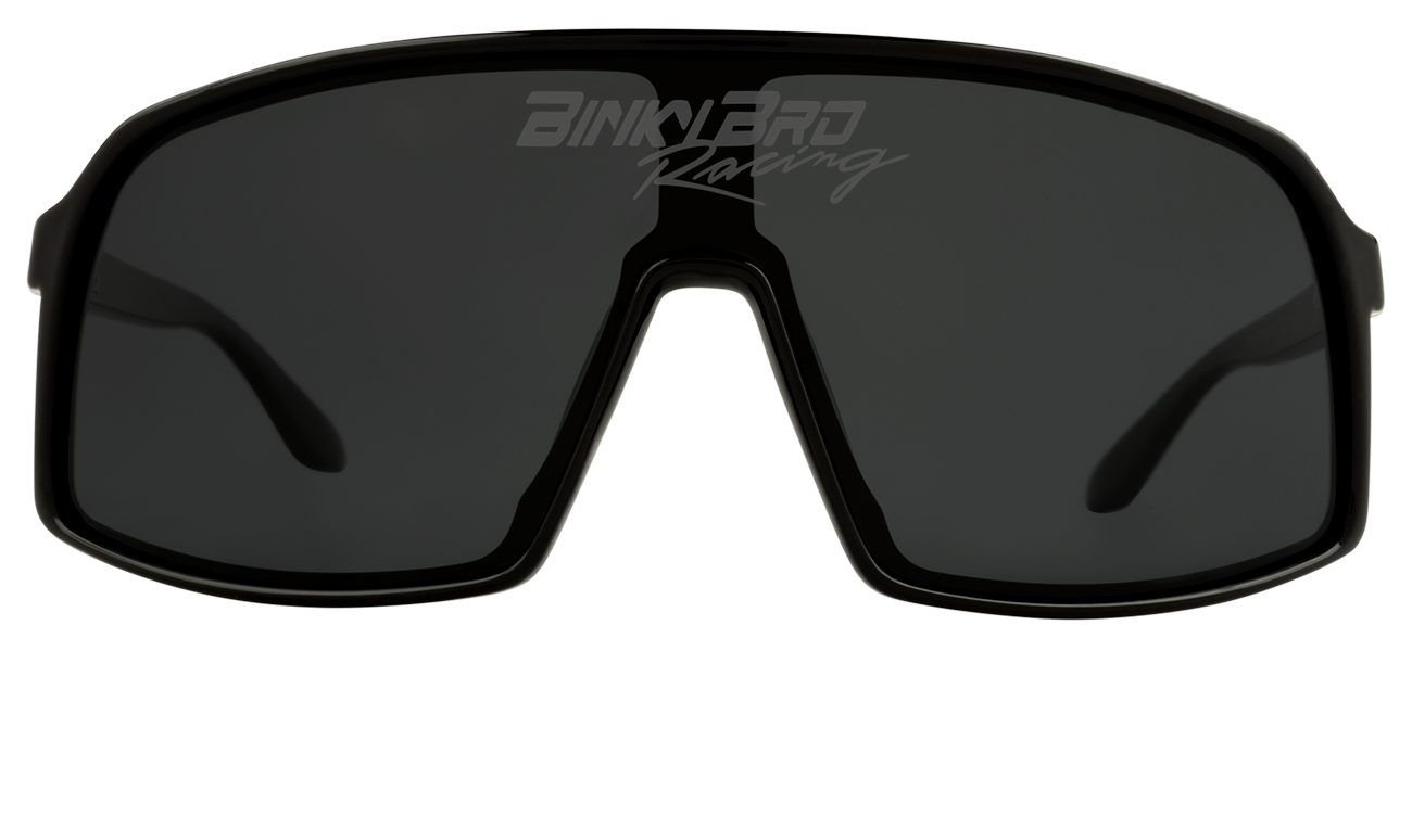 Sleek black Junior Monteverde Racing sunglasses with a wraparound design, perfect for young adventurers.