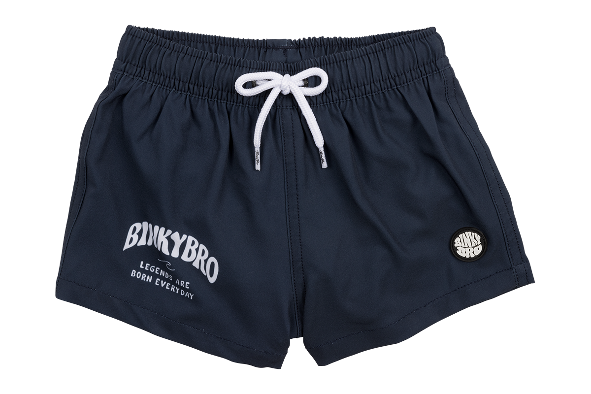 Navy blue swim shorts for kids featuring a white drawstring and BinkyBro logo, perfect for beach and pool days.