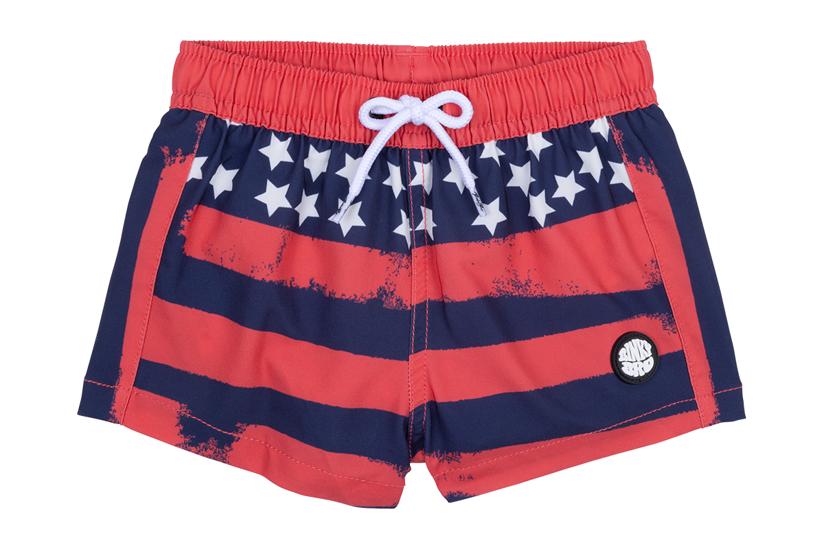 Red swim trunks featuring a distressed American flag design with white stars and a drawstring waist. Ideal for summer fun.