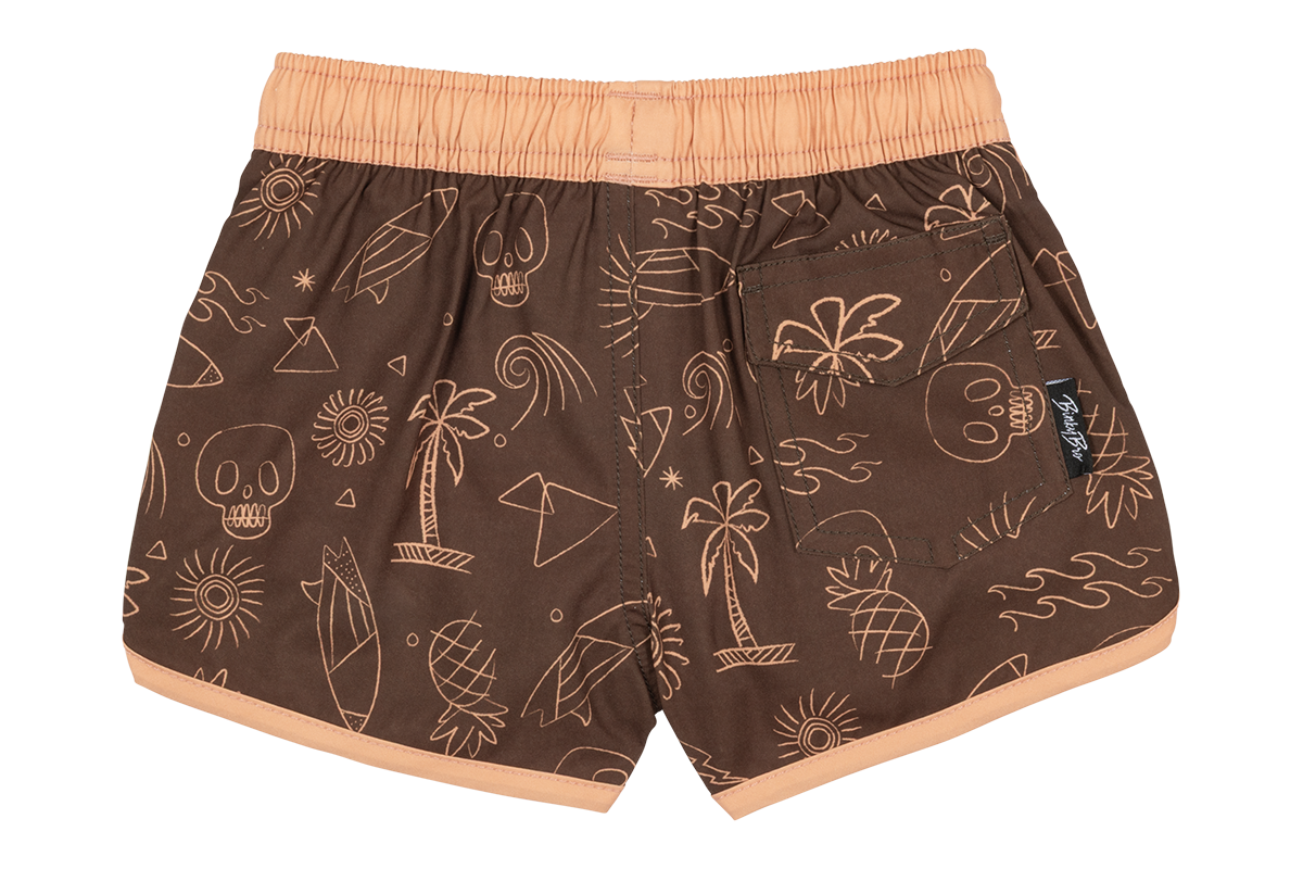 Brown swim shorts featuring a playful pattern of skulls, palm trees, and tropical elements, perfect for kids' summer fun.