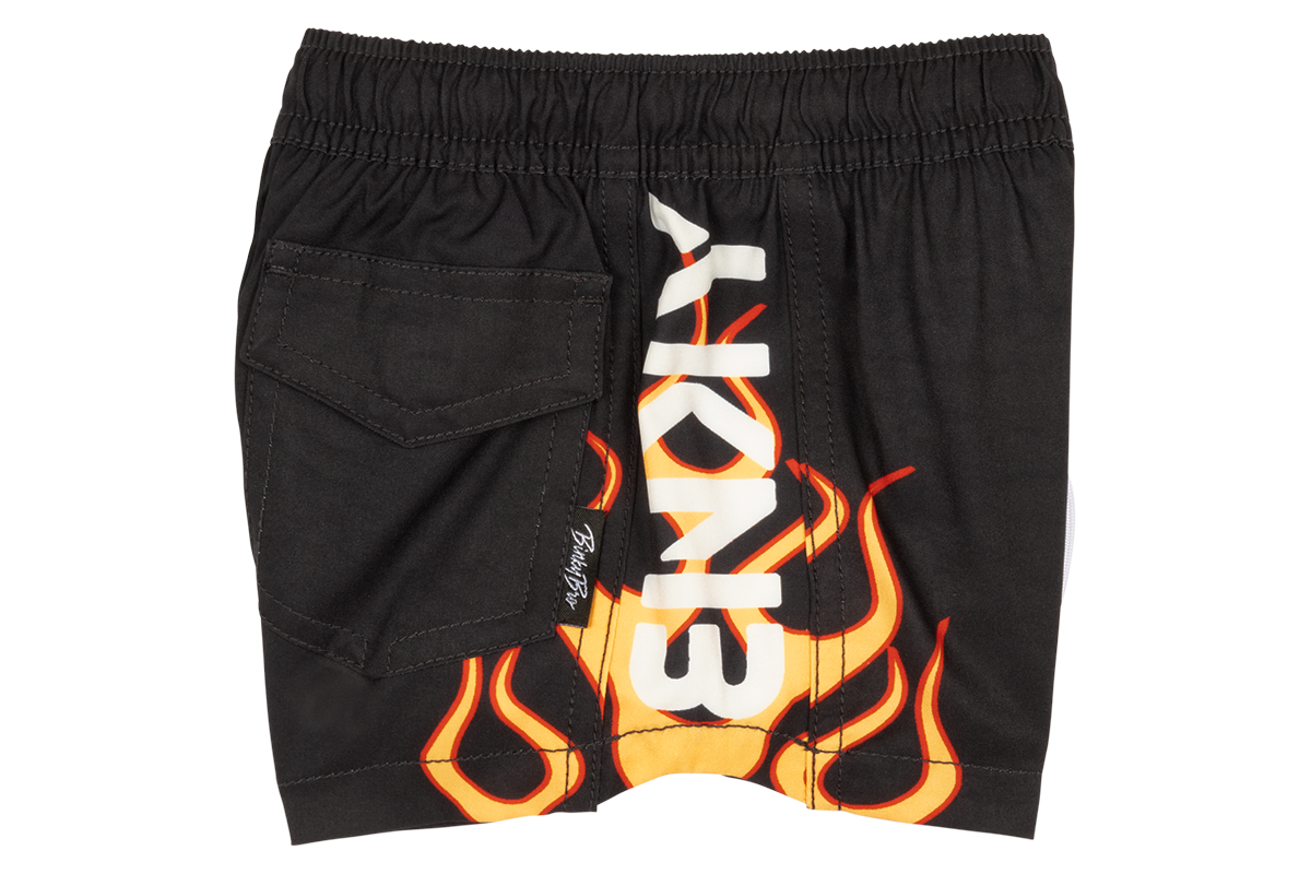 Black shorts featuring a bold flame design and a side pocket, perfect for active kids with a stylish edge.