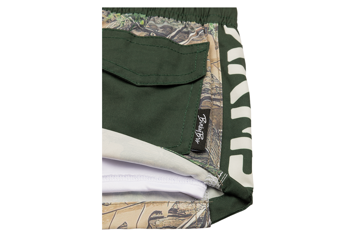 Stylish green shorts featuring a nature-inspired stamped design, perfect for outdoor adventures and active play.