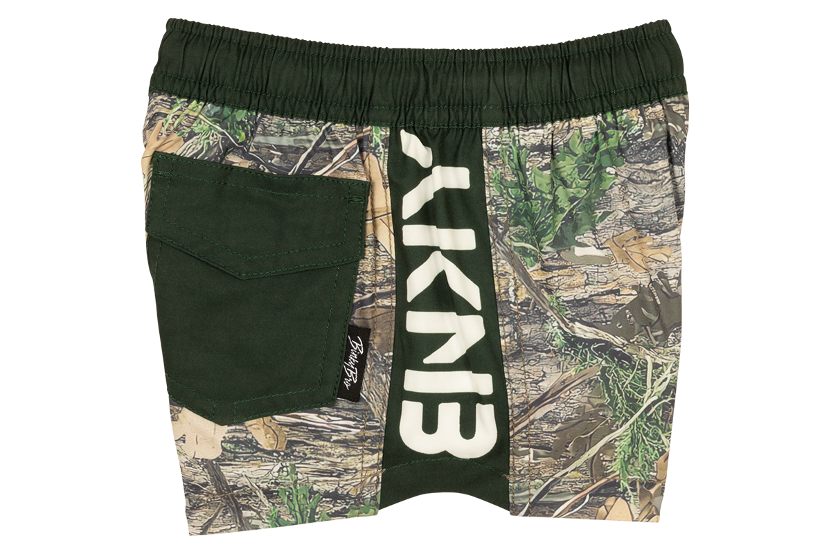 Stylish green and camo swim trunks featuring a large BinkyBro logo, perfect for adventurous kids. Ideal for summer fun.