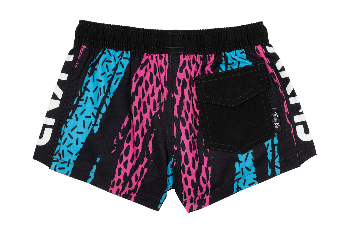 Colorful youth swim shorts featuring a vibrant design with pink and blue patterns, ideal for summer fun.