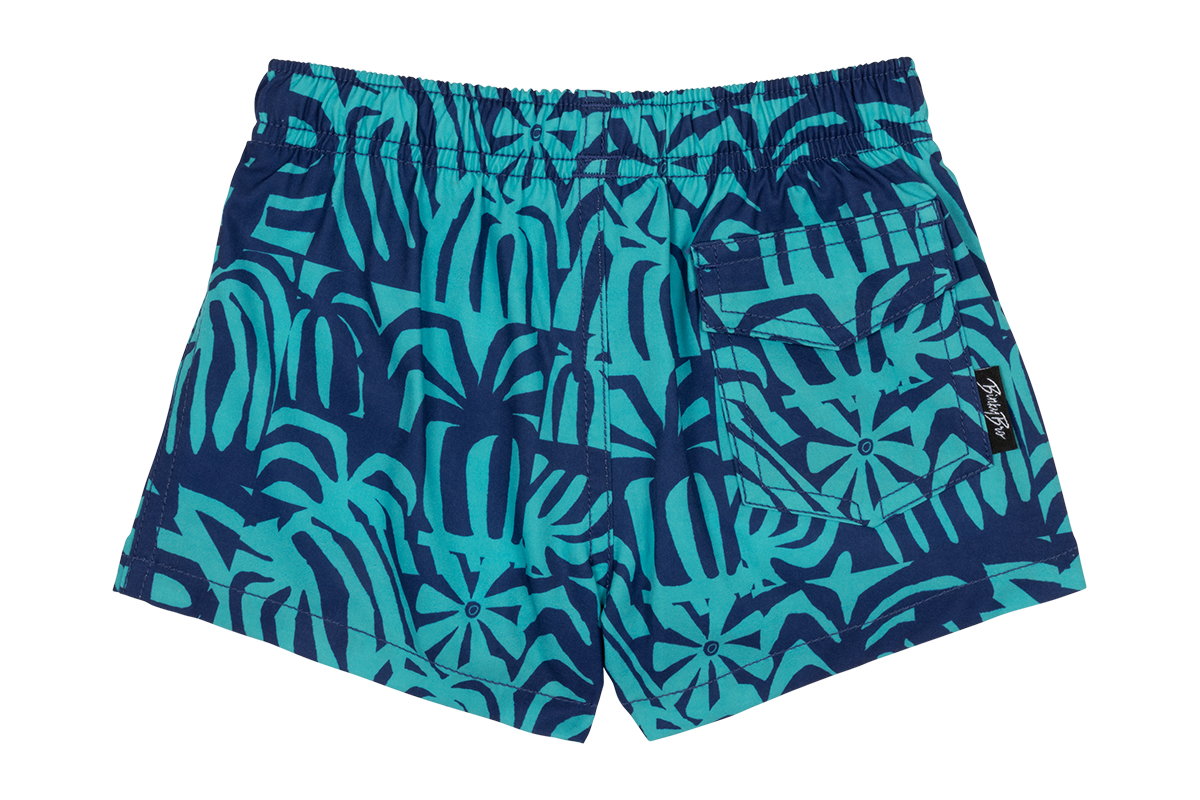 Stylish Tahitian swim shorts featuring a vibrant blue and teal tropical leaf pattern, ideal for kids' summer adventures.