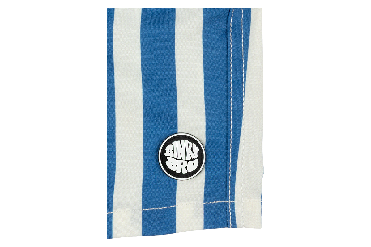 Blue and white striped fabric featuring a circular BinkyBro logo patch, showcasing stylish beachwear for kids.