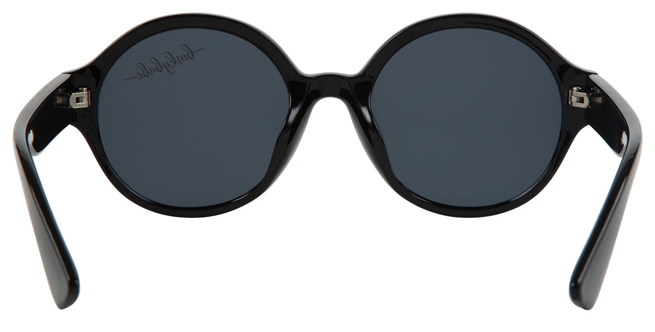 Stylish black round sunglasses with dark lenses and sleek arms, perfect for trendy kids and youth.