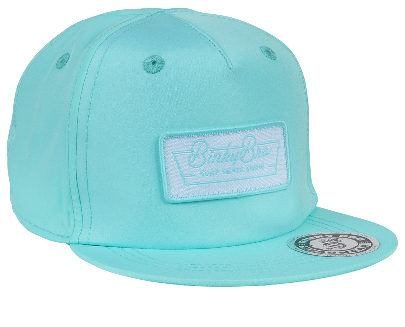 Light blue snapback cap featuring a white embroidered logo patch, designed for stylish kids' surf and skate lifestyle.