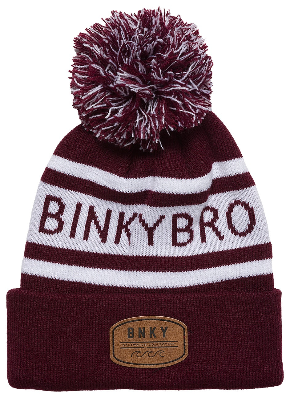 Maroon knit beanie with a white pom pom and stripes, featuring the BinkyBro logo and a leather patch.