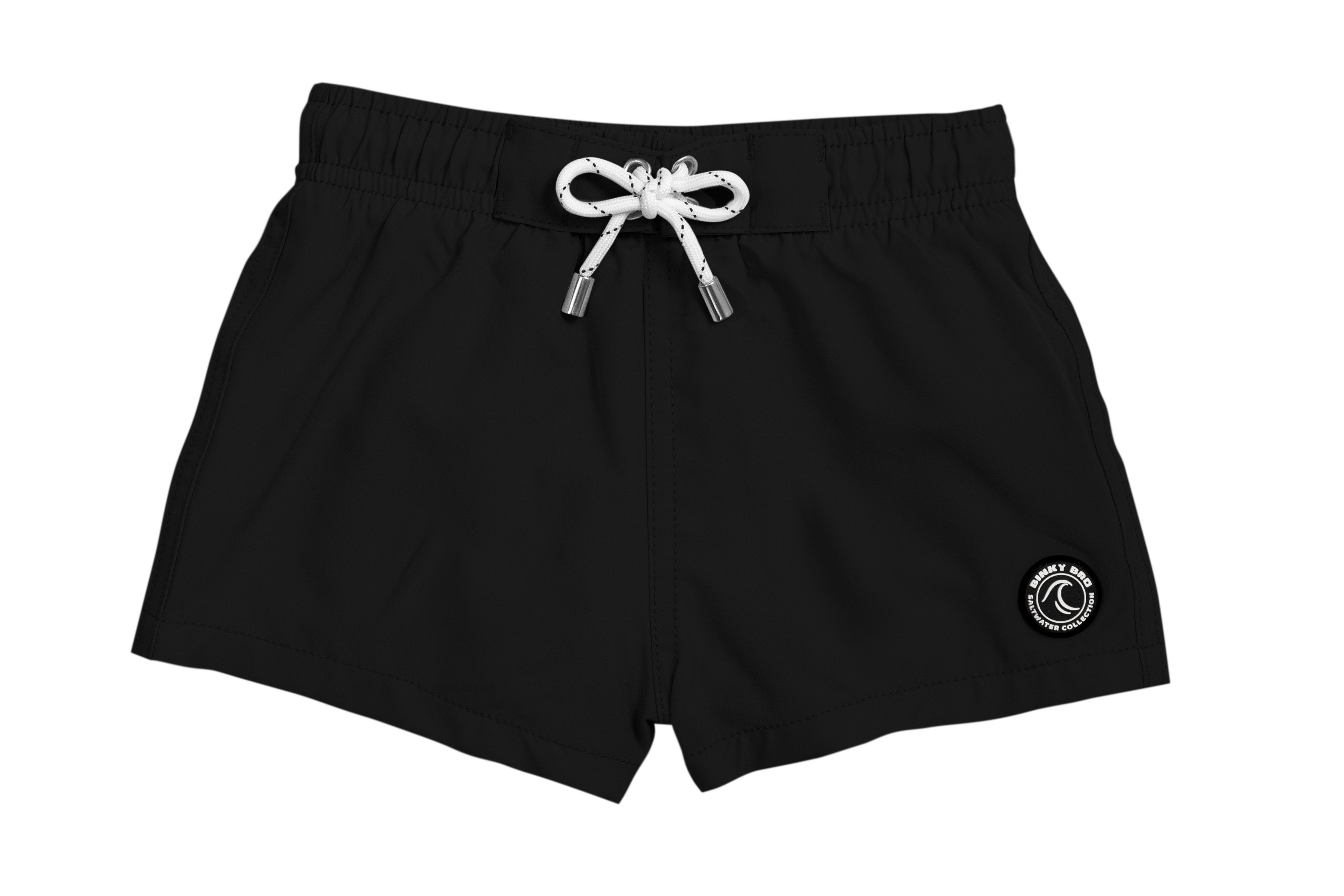 Black swim shorts for kids featuring an elastic waistband and drawstring, perfect for beach or pool days.