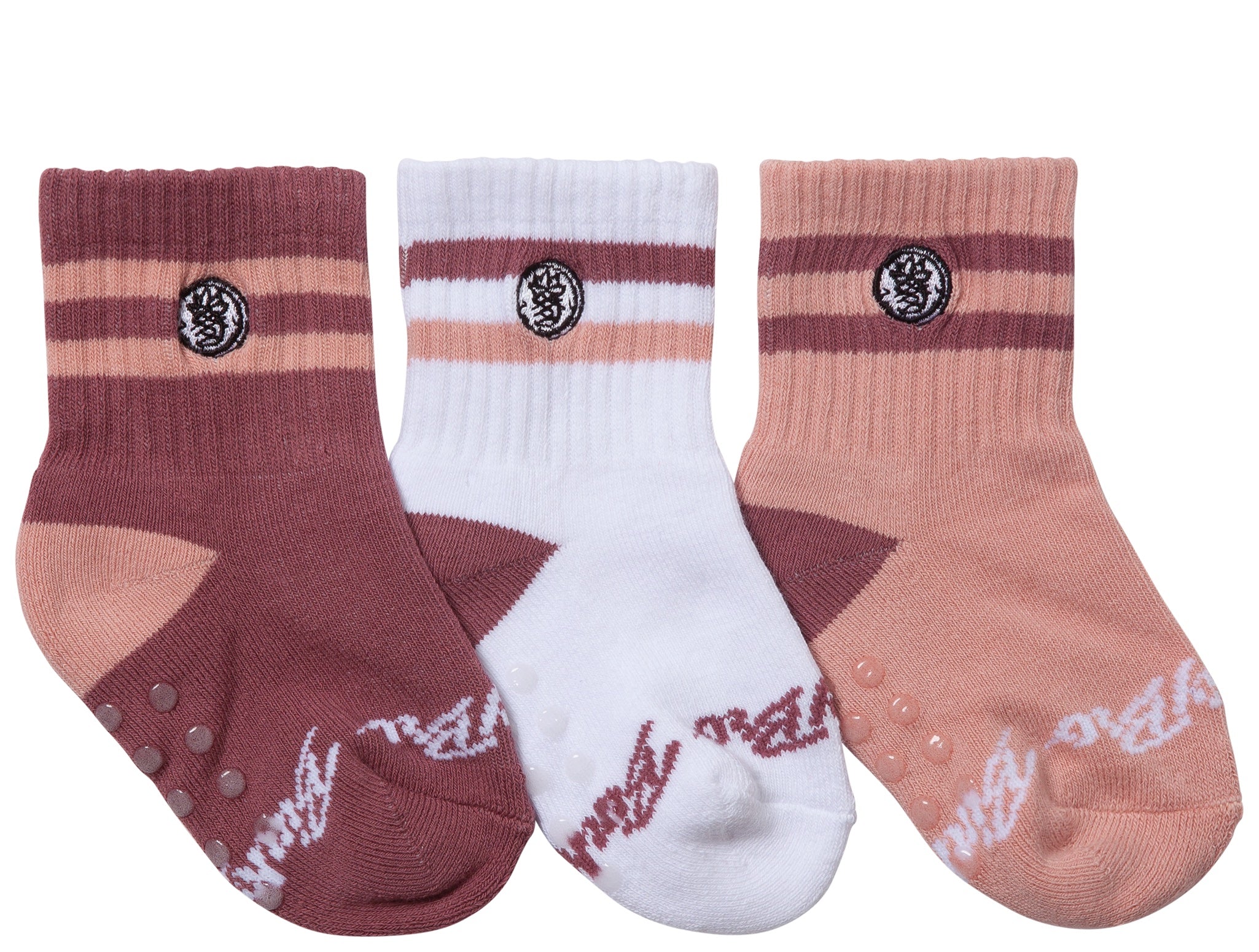 Three pairs of stylish toddler socks in currant shades, featuring ribbed cuffs and non-slip grips for active little ones.