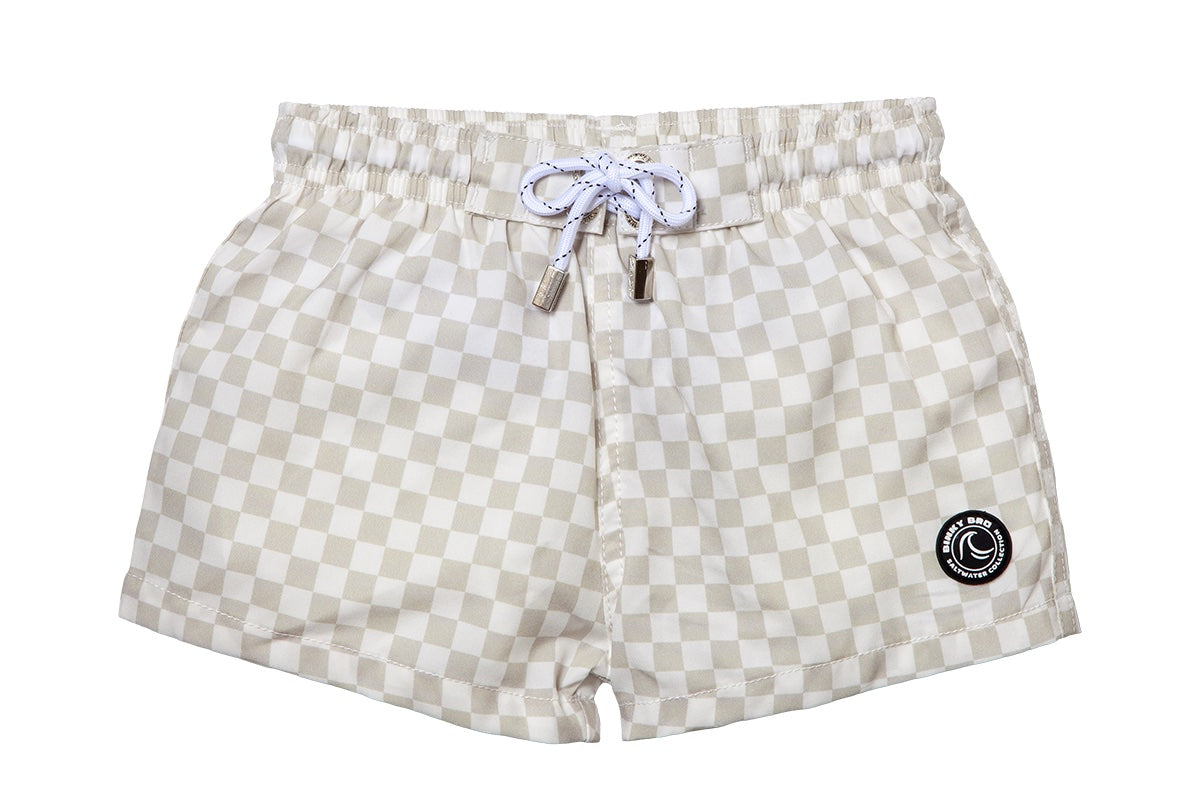 Light beige checkered swim shorts with an elastic waistband and drawstring, featuring a logo patch on the side.