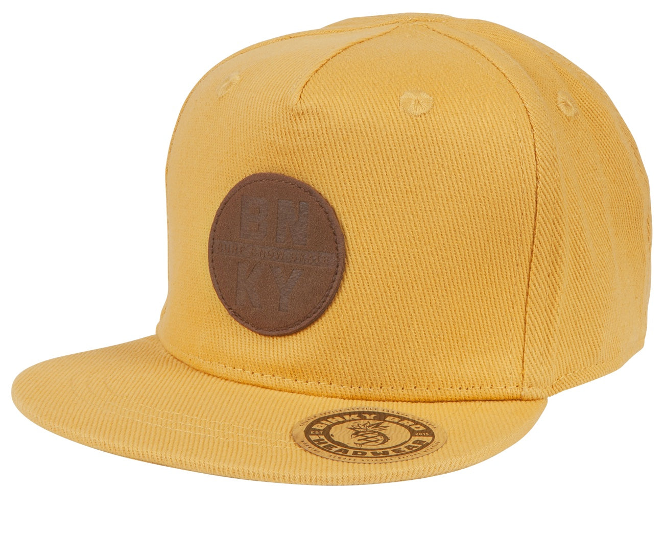 Stylish yellow snapback hat featuring a brown leather patch logo, perfect for kids' surf-snow-skate lifestyle.