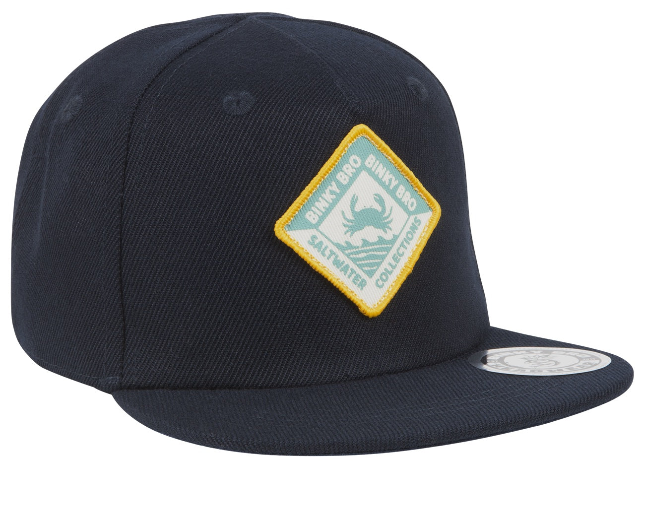 Navy snapback hat featuring a yellow and green Puget Sound patch, designed for infants and toddlers with a surf-snow-skate vibe.