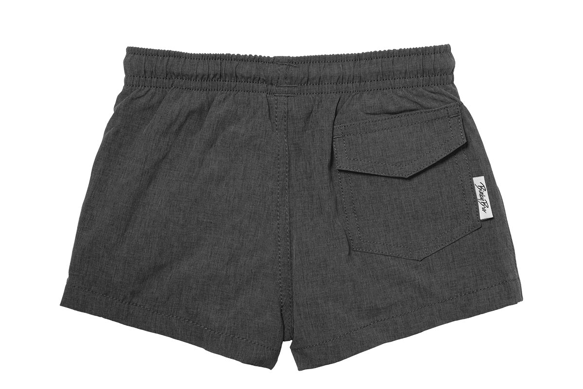 Stylish dark gray swim shorts for kids featuring an elastic waistband and a back pocket, perfect for beach days.