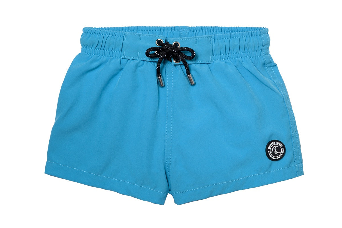 Bright blue swim shorts for kids with an elastic waistband and adjustable drawstring, perfect for summer fun.