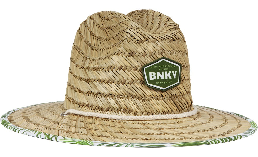 Stylish straw sun hat with a green BNKY patch, featuring a wide brim and tropical leaf trim, perfect for kids.