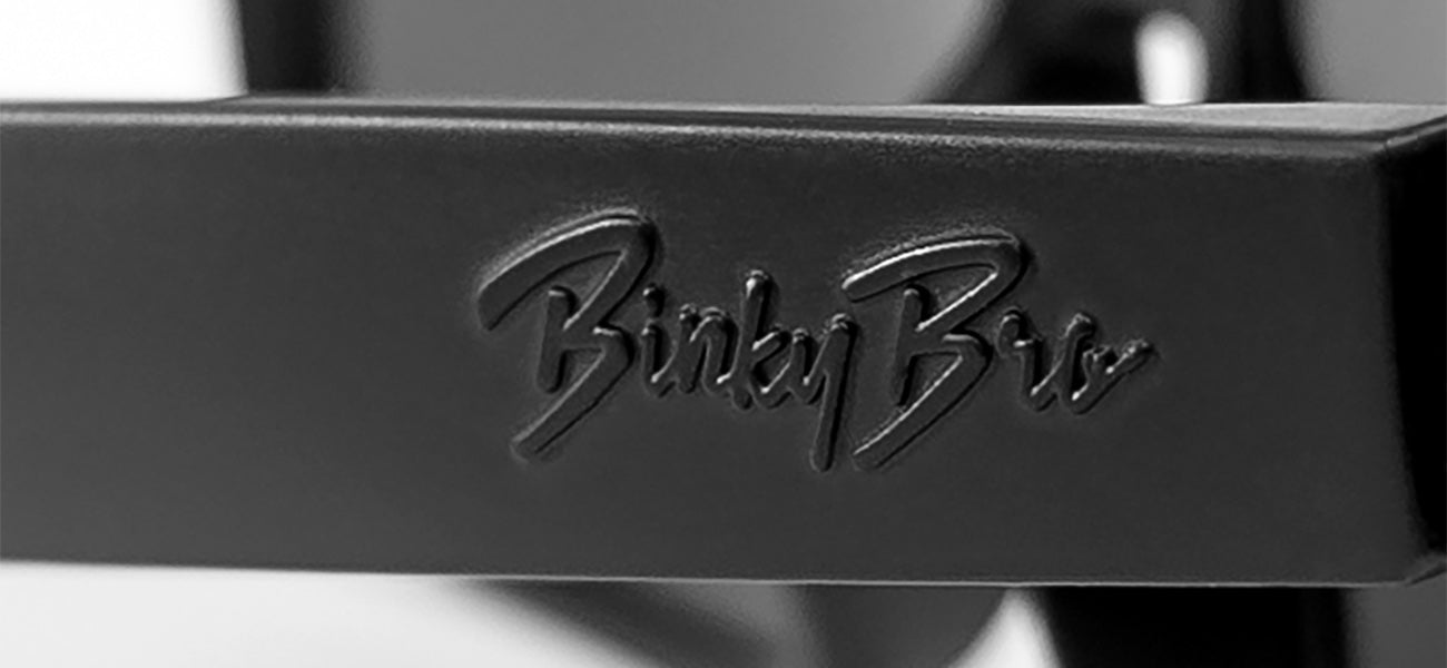 Stylish black sunglasses with a textured BinkyBro logo on the arm, perfect for kids' outdoor adventures.