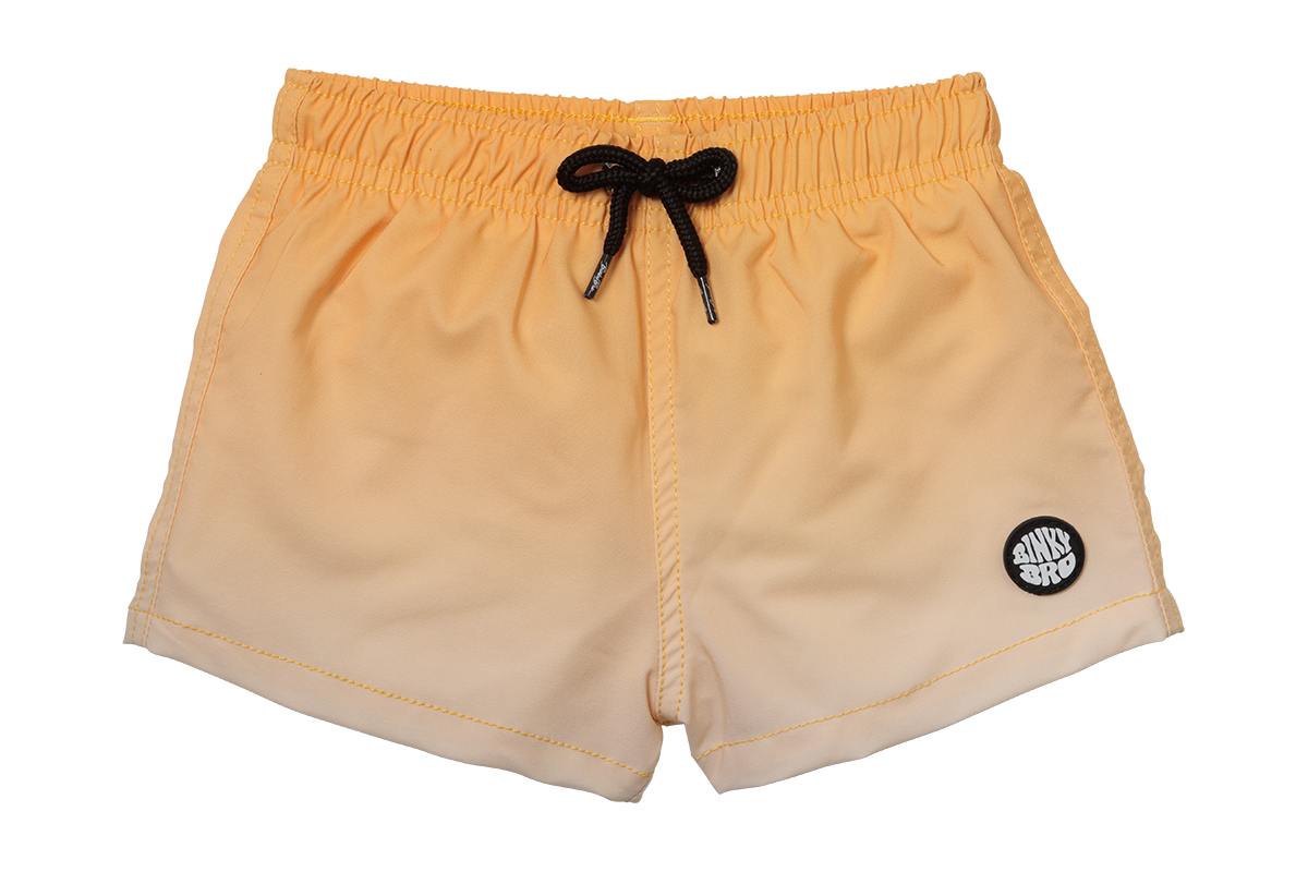 Light orange swim shorts with an elastic waistband and black drawstring, featuring a circular logo on the side.