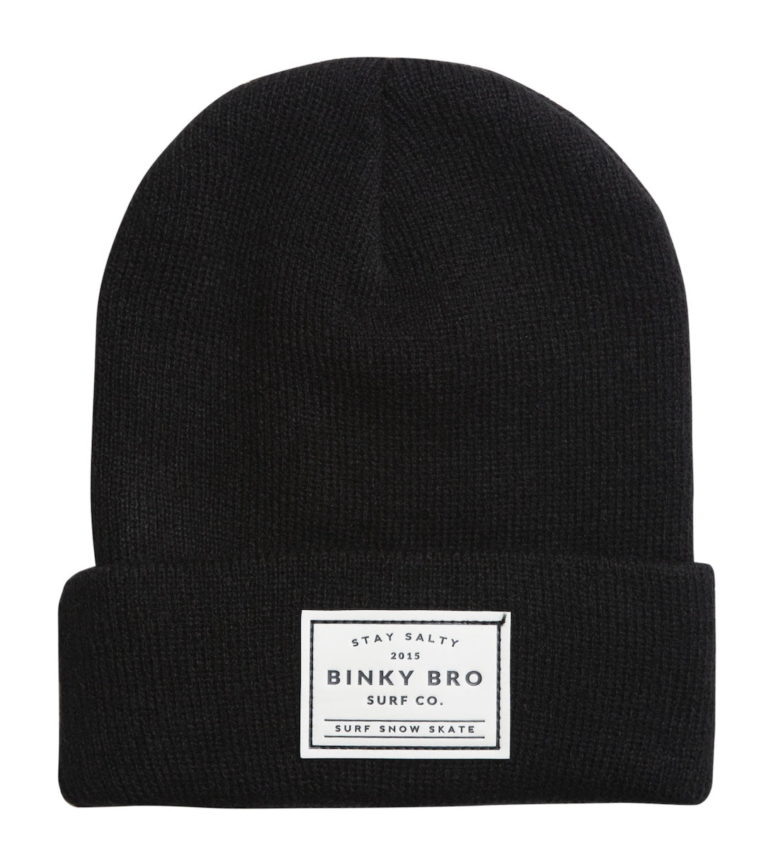Black beanie hat from BinkyBro featuring a folded cuff and a white label with the brand logo, ideal for stylish kids.