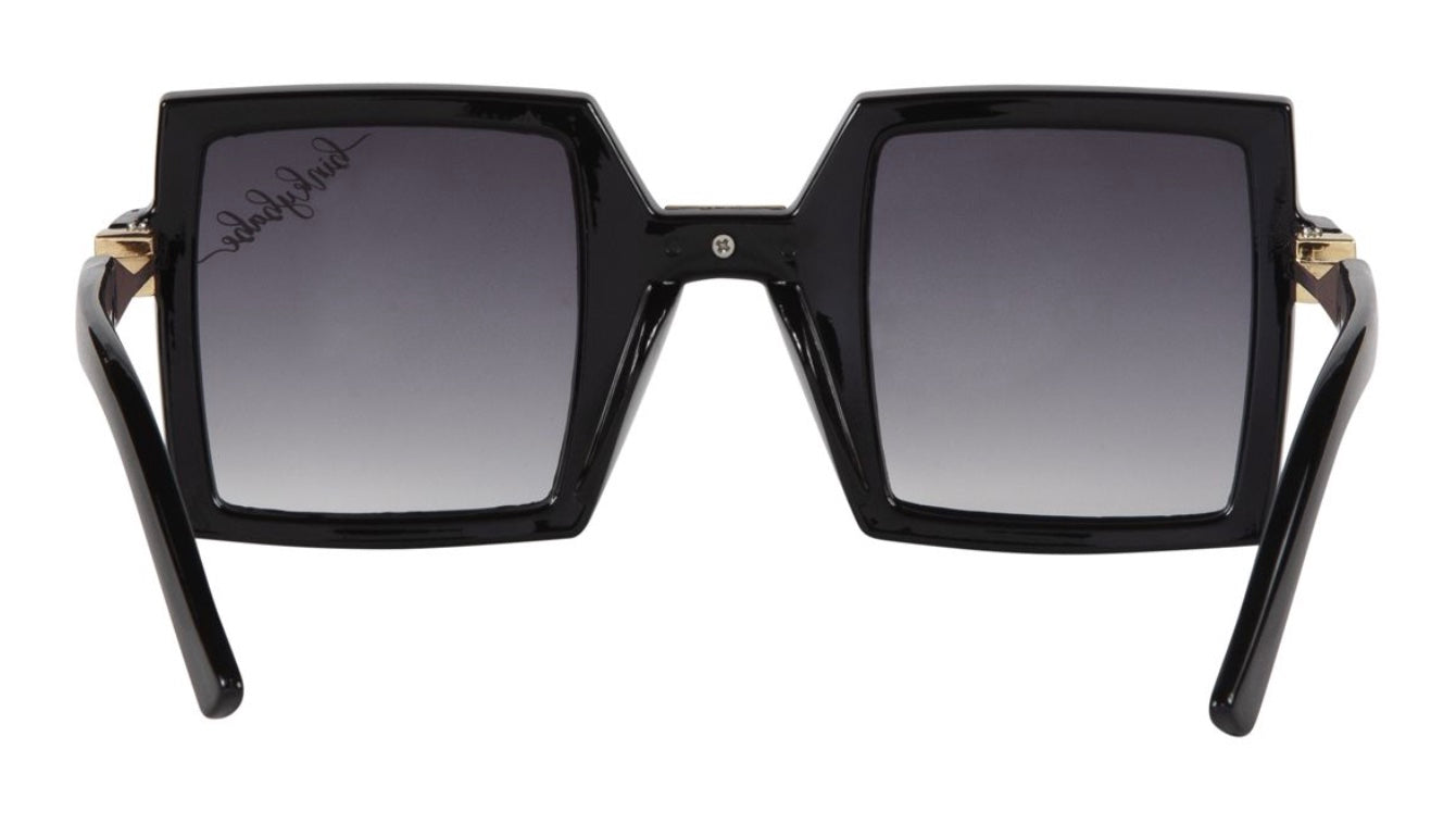 Stylish black square sunglasses with gradient lenses and gold accents, perfect for a trendy look. Ideal for sun protection.