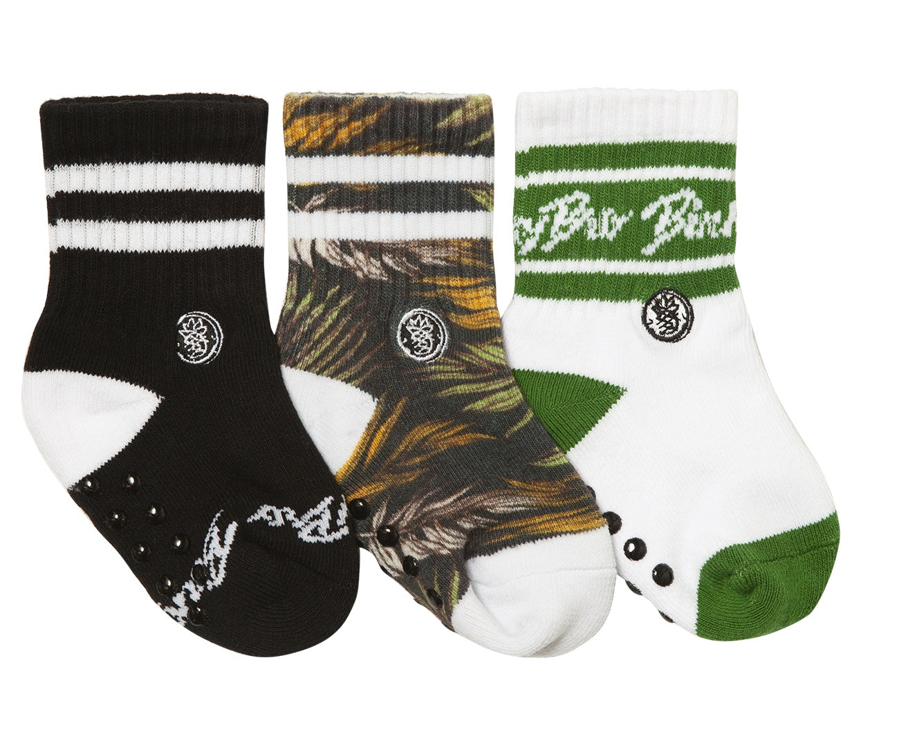 Three pairs of stylish socks featuring black, palm print, and green designs, perfect for kids' casual wear.
