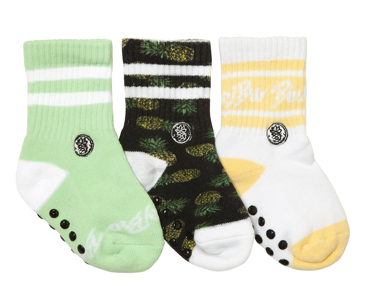Three pairs of kids' socks featuring pineapple designs in green, black, and white with yellow accents, perfect for stylish young ones.