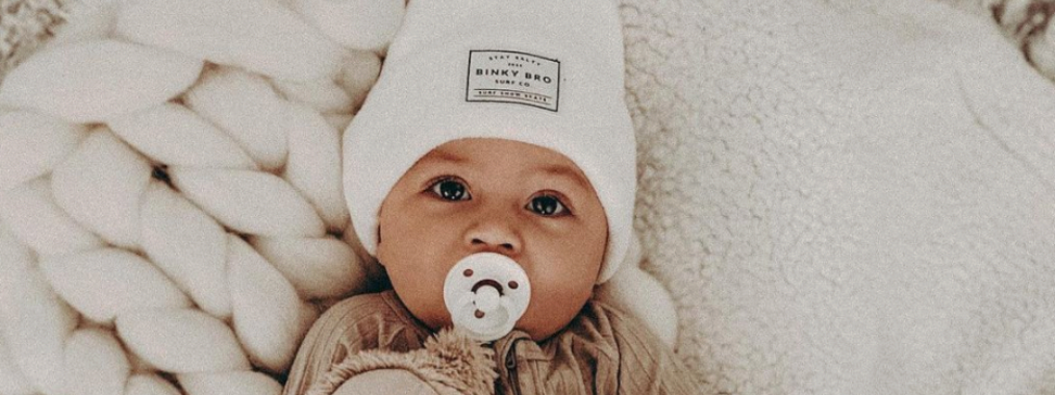 baby with white styled beanie