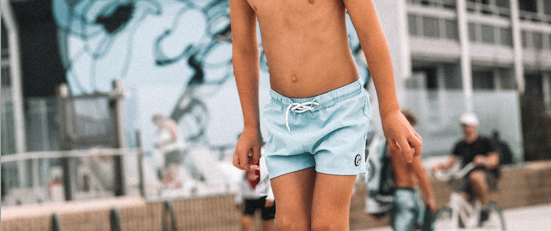 toddler wearing a binkybro swimsuit