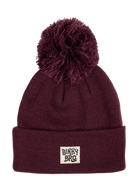 Maroon beanie with a large pom-pom on top and a BinkyBro logo patch, perfect for stylish kids' winter wear.
