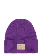 Purple knit beanie featuring a leather logo patch, perfect for stylish warmth in any outdoor adventure.