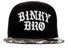 Stylish black snapback hat with bold white "Binky Bro" embroidery and a unique patterned brim, perfect for kids.