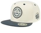Stylish cream and navy snapback cap featuring BinkyBro logo, perfect for infants and toddlers embracing surf and skate culture.