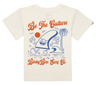 Cream-colored youth t-shirt featuring a playful graphic with a smiling wave, palm tree, and the text "Be The Culture.