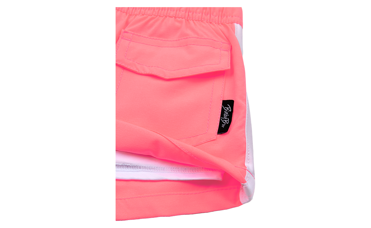 Bright coral shorts featuring a comfortable elastic waistband and a stylish pocket, ideal for active kids.
