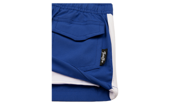 Close-up of the Blaze Royal shirt featuring a blue fabric with a white trim and a pocket detail, showcasing BinkyBro branding.