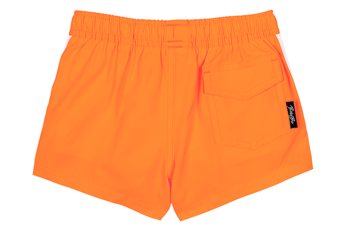 Bright tangerine swim shorts with an elastic waistband and back pocket, perfect for active kids. Ideal for summer fun.