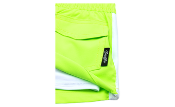 Bright neon green shorts with a white trim and a small BinkyBro label on the pocket, designed for active kids.