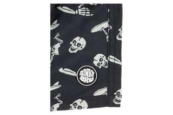 Stylish black fabric featuring a playful skull and crossbones pattern, showcasing BinkyBro's unique design for kids.