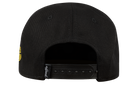 Black snapback hat with a yellow logo on the back, featuring an adjustable strap for a custom fit.