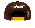 Brown snapback hat with yellow accents and "Binky Bro" logo on the back, designed for stylish youth apparel.