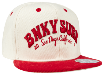 Stylish Gaslamp snapback hat in cream and red, featuring bold embroidered text and a flat brim, perfect for kids.