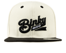 Stylish cream snapback hat with black BinkyBro logo, perfect for infants and toddlers embracing surf-snow-skate culture.