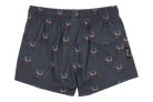 Stylish swim trunks featuring a palm tree print, perfect for kids who love a surf-snow-skate lifestyle.