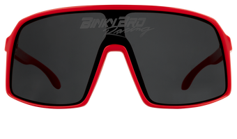 Sleek crimson sunglasses with a bold design and dark lenses, perfect for active youth and outdoor adventures.