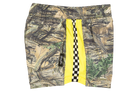 Stylish Norfolk swim shorts featuring a camouflage pattern with a vibrant yellow and checkered stripe detail.