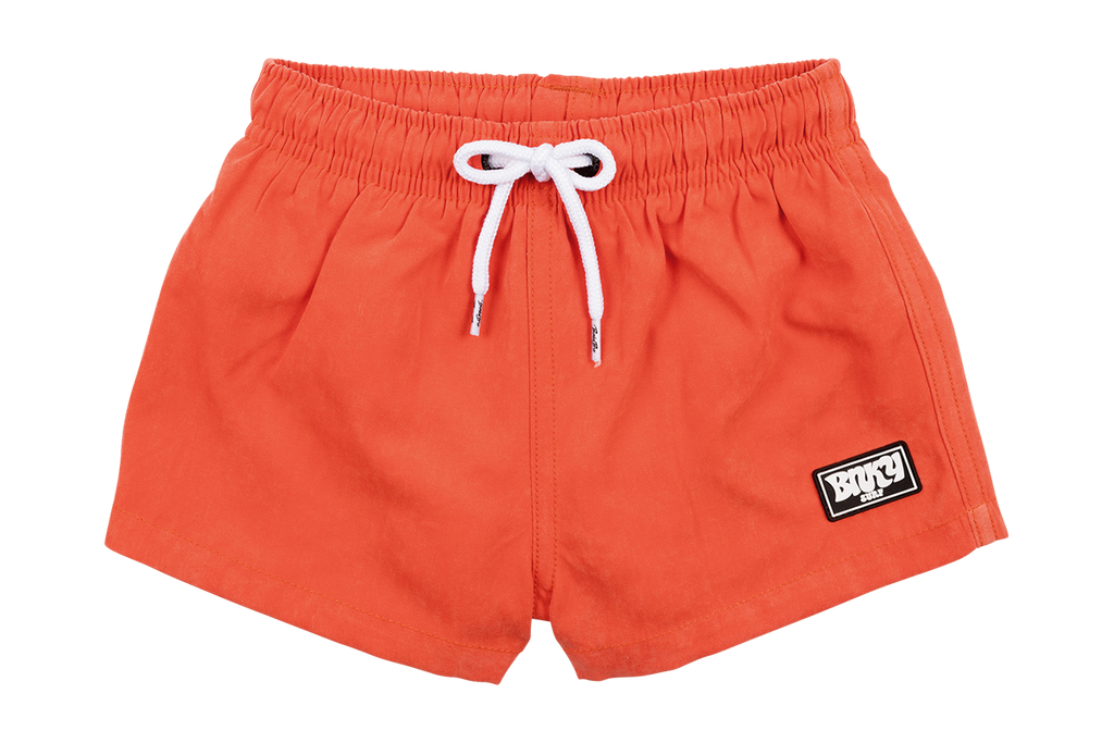 Our Tangerine Suede Swimmie is a bright orange pair of swim trunks with a BNKY logo in the corner. Our Swimmies are styled after a more euro-fit. Meaning, the length of the shorts will land anywhere between a little above the knee to mid-thigh-ish (depending on the length of the child). It is designed this way--its our style! Shop our full collection of toddler swimsuits.